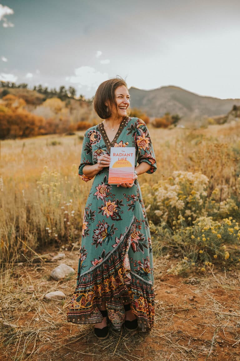 Kate holding her book Radiant Life