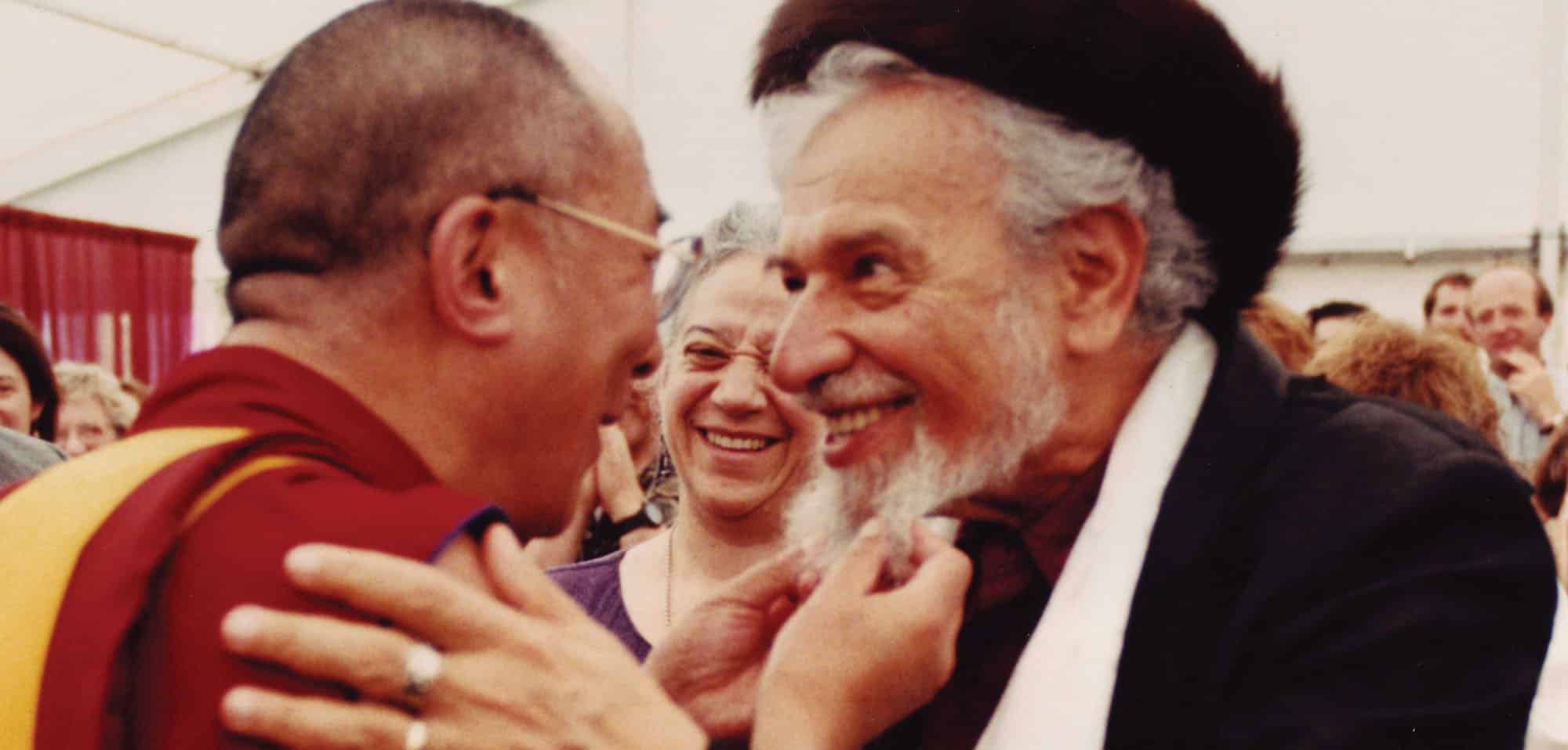 The Dalai Lama tugs on Rabbi Zalman Schachter-Shalomi's beard at Naropa in 1997