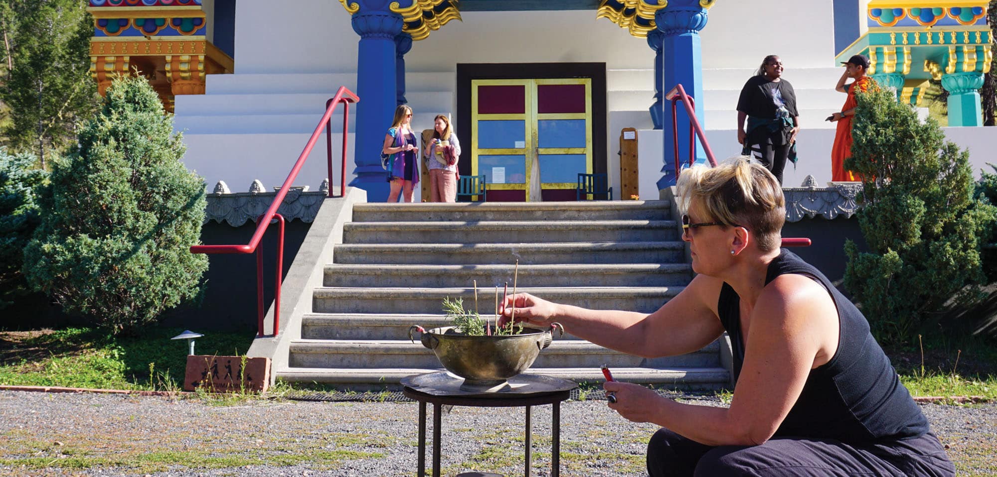 Amelia Hall in front of the Great Stupa of Dharmakaya at Drala Mountain Center
