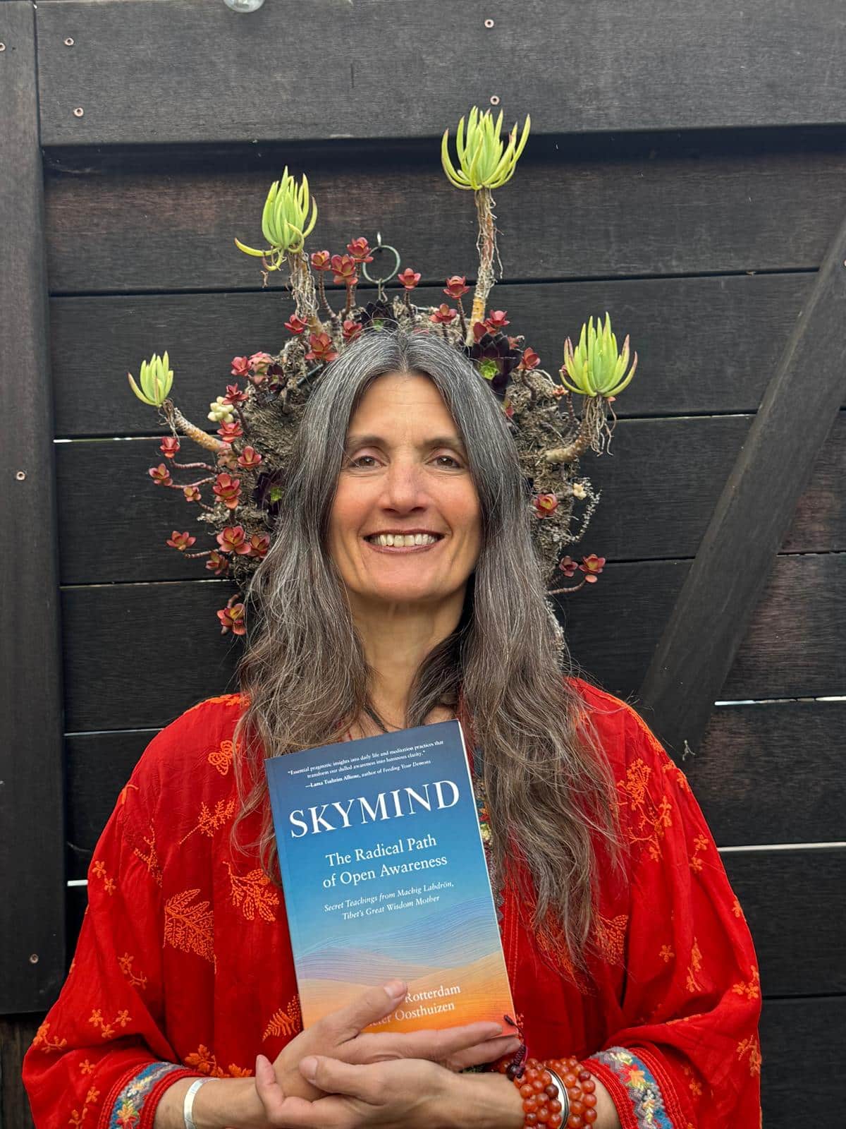 Charlotte Rotterdam holds a copy of her new book SkyMind.